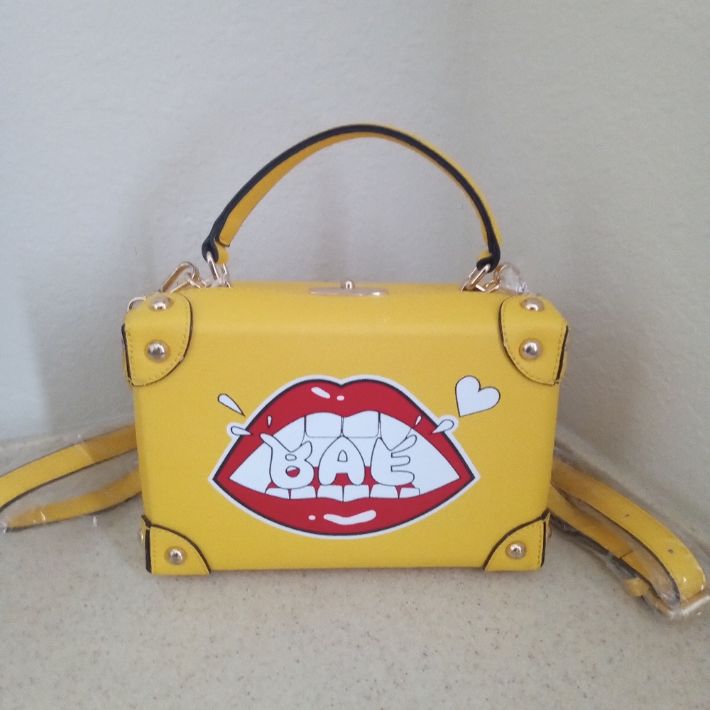 Beautiful Yellow BAE Box Crossbody handbags.